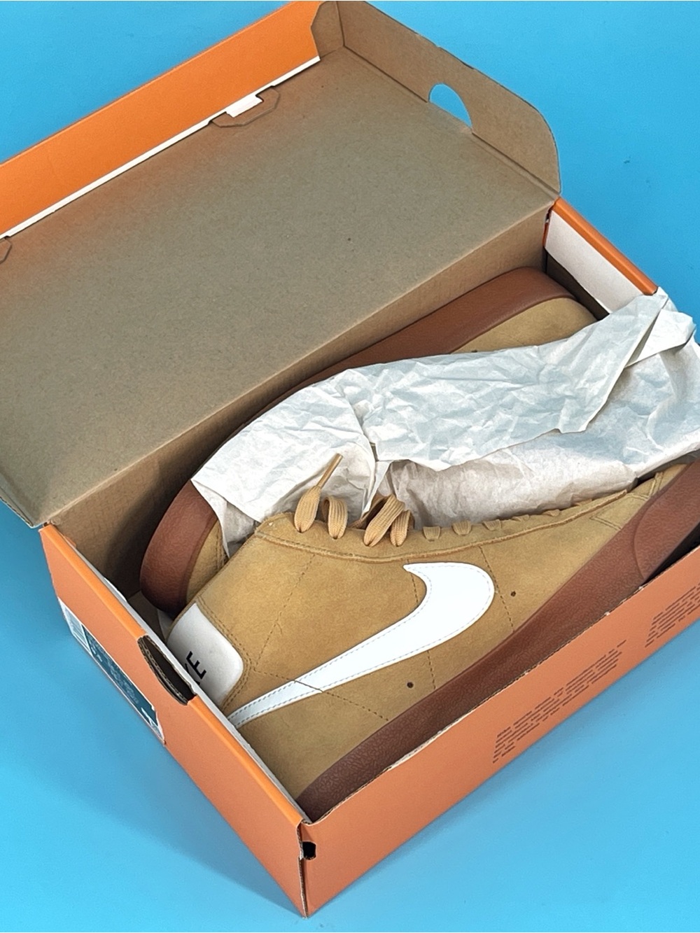 Nike Tan Suede Low-Top Sneakers with White Swoosh and Brown Soles